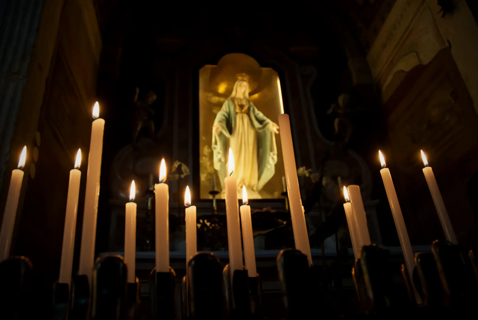 Candles burning before the chapel of the Immaculate in San Zeno in Oratorio, Verona