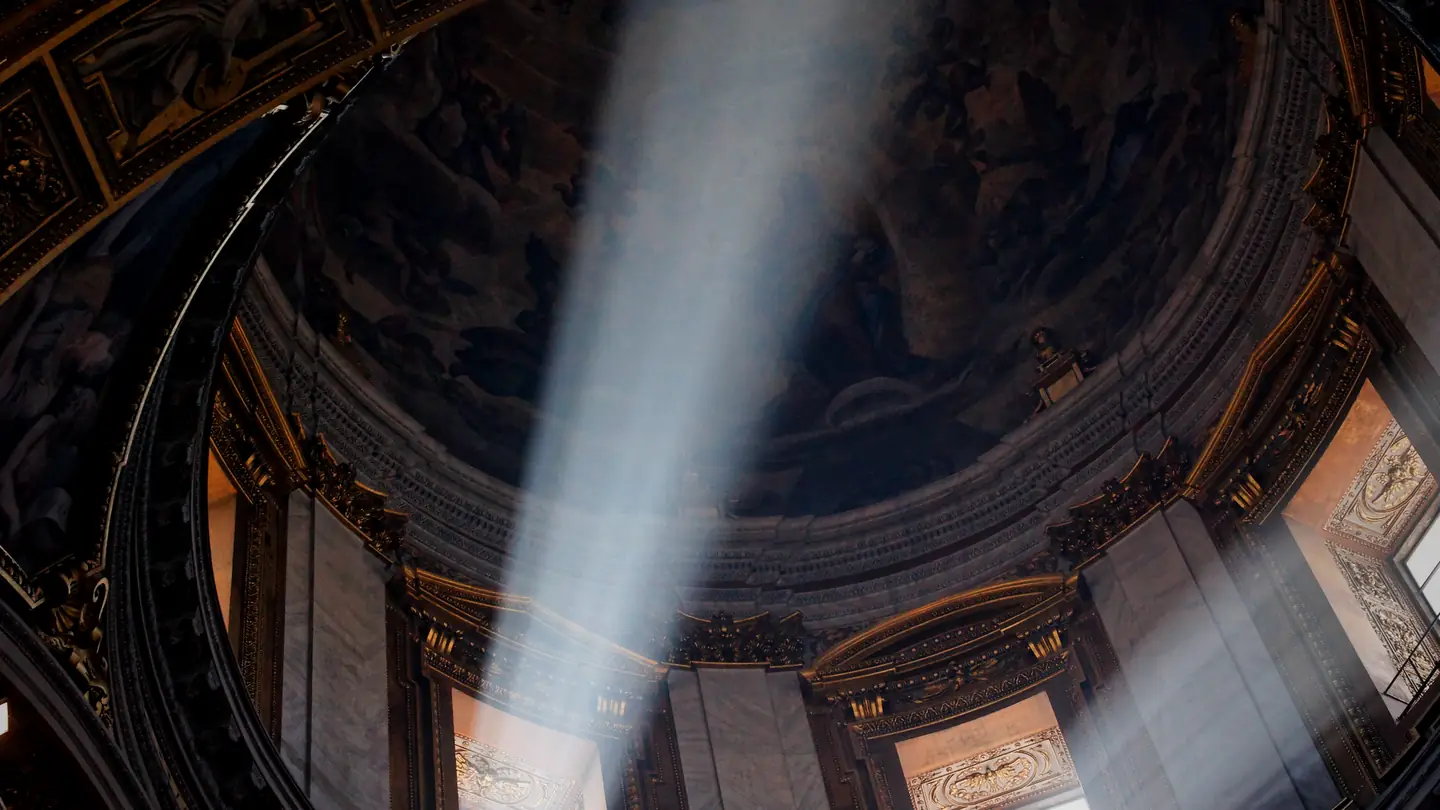 The dome of the Pauline Chapel in Santa Maria Maggiore, Rome, crossed by a single shaft of sunlight