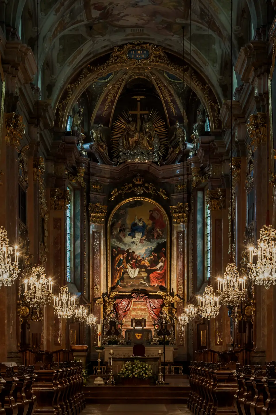 The baroque high altar of St. P&ouml;lten Cathedral in Austria, lit by candles and chandeliers